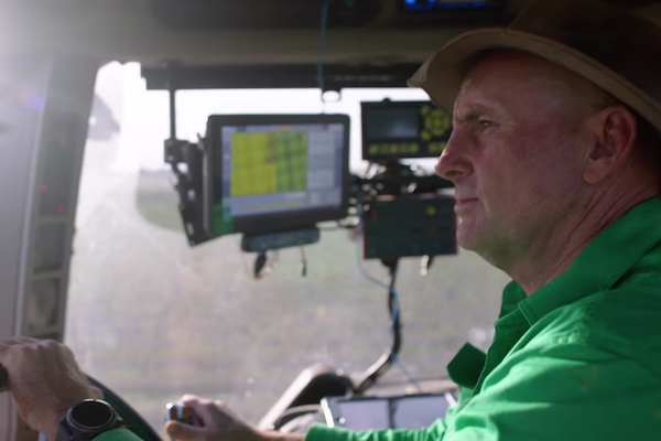 Rob operating agricultural machinery in the paddock.
